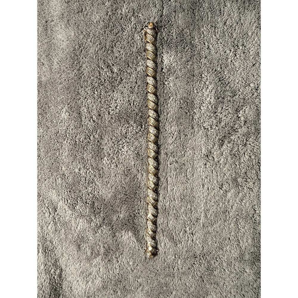 Gold-plated sterling silver tennis bracelet featuring cubic zirconia stones
